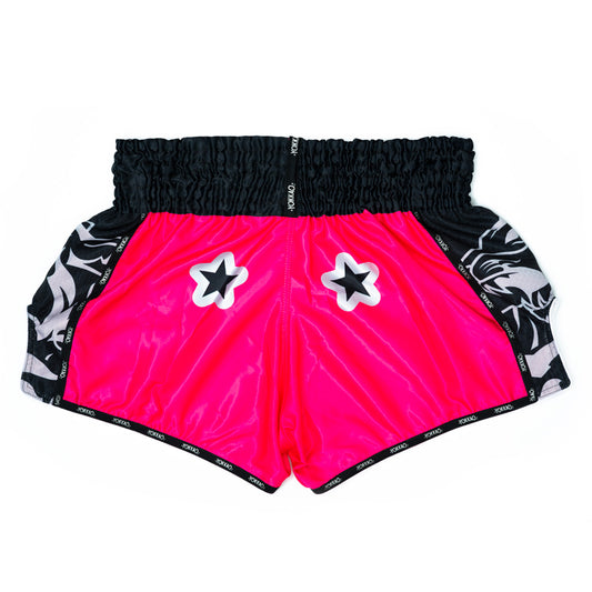 Yokkao pink shorts with black and white patterns on a white background